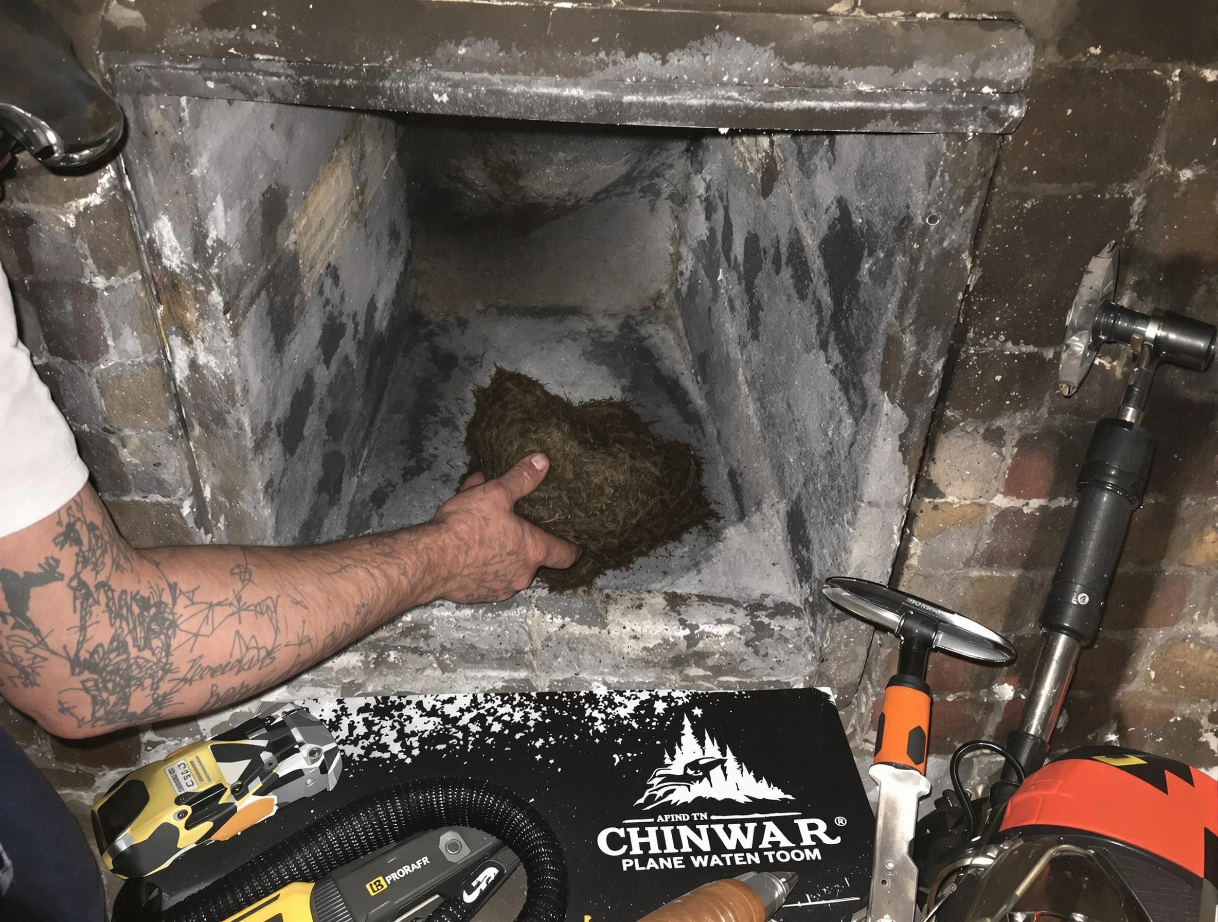 West Point Chimney Sweep safely removing debris and screening chimney in West Point, VA
